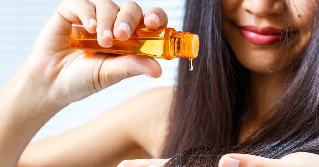 almond oil or coconut oil for hair comparison showing oil applied on hair strands