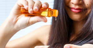 almond oil or coconut oil for hair comparison showing oil applied on hair strands