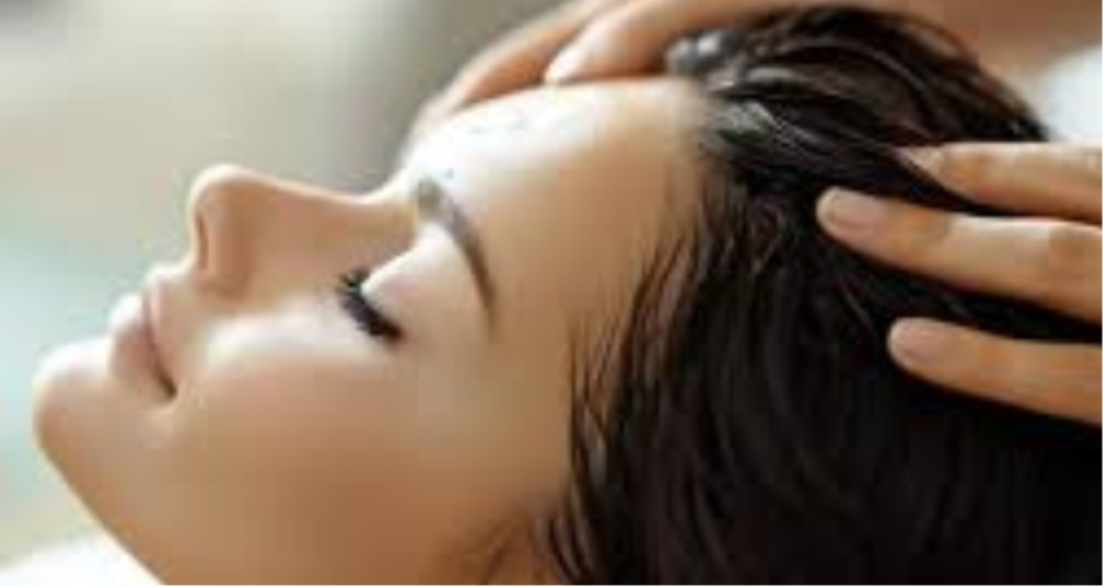 Applying Swastik Castor Oil for Hair with a gentle scalp massage to nourish the roots