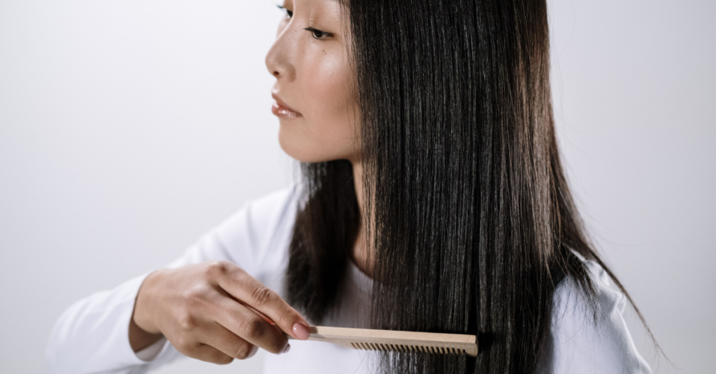Woman following a gentle hair care routine for a healthy scalp