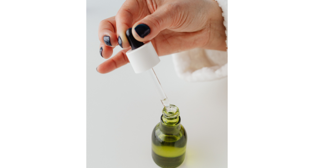 Woman applying amla shikakai hair pack