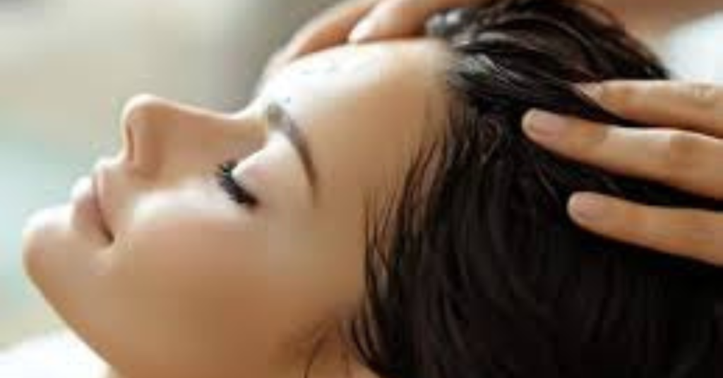 Woman applying a natural aloe vera hair pack