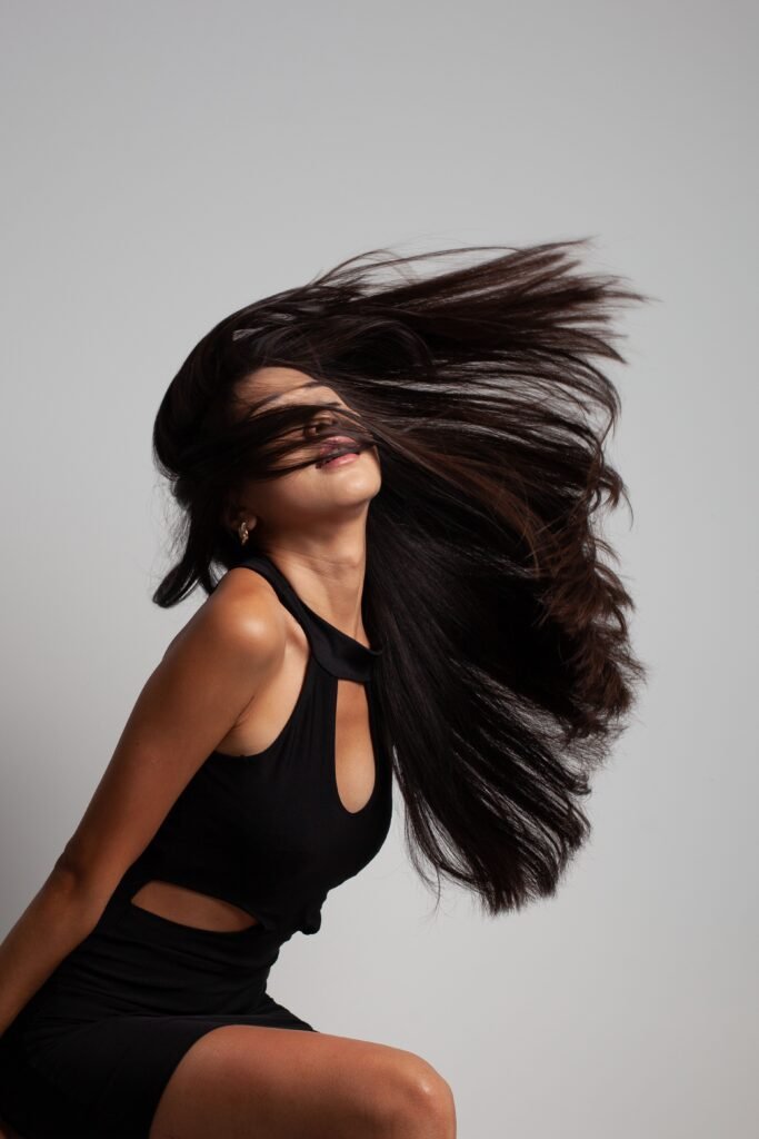Woman with healthy hair after hair-care routine